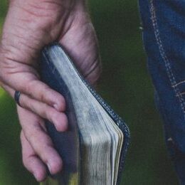 Guy holding Bible