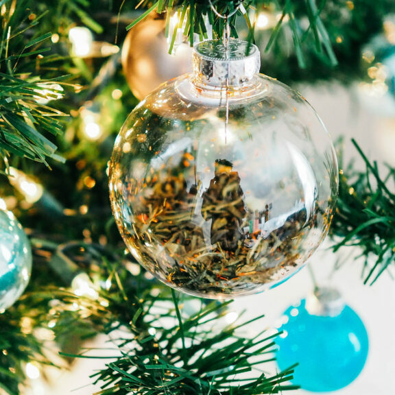 clear-and-teal-glass-baubles-hanged-on-lighted-Christmas-tree
