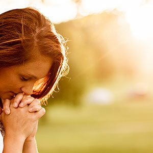 Woman praying light